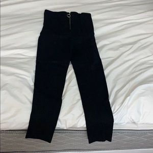 Black pants with loop pull zipper